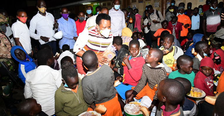 Col. Edith Nakalema serving stranded children at Namayiba bus terminal before ensuring that they return home safely. 8 June 2021